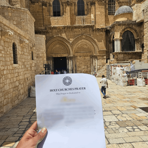Prayer being placed at the Church of the Holy Sepulchre courtyard, Jerusalem